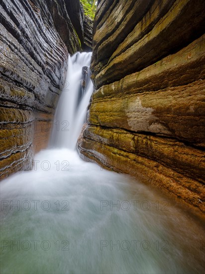 The Taugl or Tauglbach flows through the red gorge