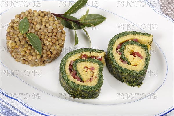 Polenta Spinach Roulade with Alblinsen arranged on a serving plate