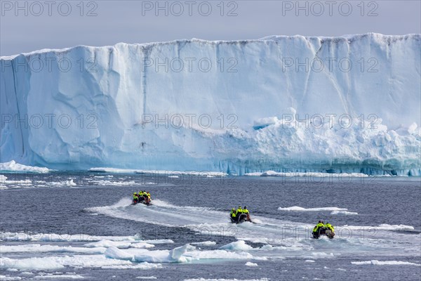 Zodiacs dinghies on the way to table icebergs