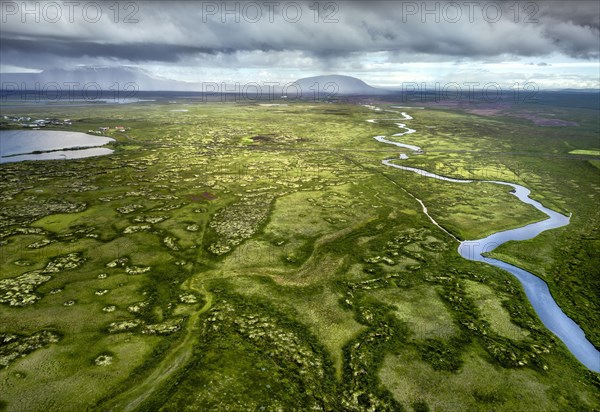 Wide green plain with river