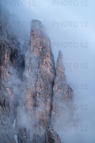 Rock face framed by clouds