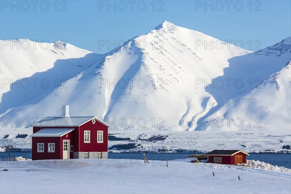 Lonely red house on the Akureyrifjord