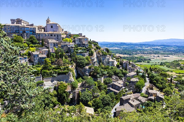 Nested houses of the mountain village of Cordes with castle and church on the top