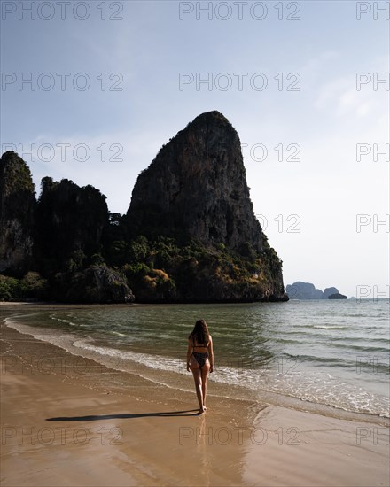 Woman walking along the beach