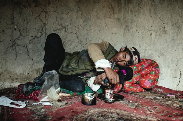 Man lying on a carpet