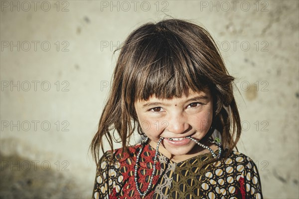 Girl with short cut pony