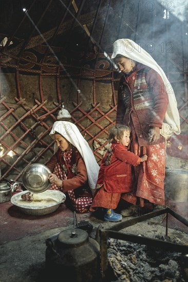 Two woman and a child in traditional Kyrgyz traditional traditional traditional traditional traditional traditional traditional traditional traditional costume