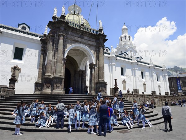 School class in school uniform on the steps of the cathedral