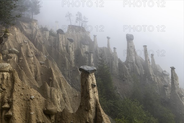 Earth pyramids near Perchau in the mist