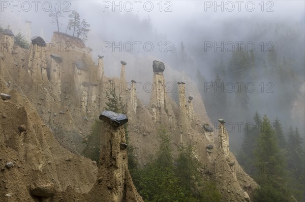 Earth pyramids near Perchau in the mist