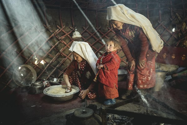 Two woman and a child in traditional Kyrgyz traditional traditional traditional traditional traditional traditional traditional traditional traditional costume