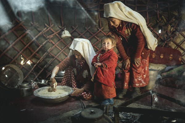 Two woman and a child in traditional Kyrgyz traditional traditional traditional traditional traditional traditional traditional traditional traditional costume