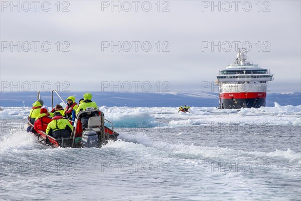 Zodiac dinghy on the way to cruise ship