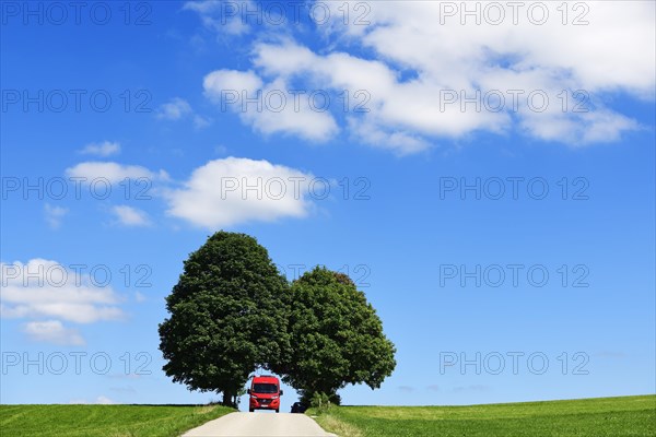 Motorhome on picture book country road near Berg