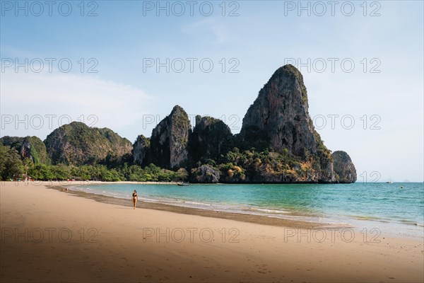 Woman walking along the beach