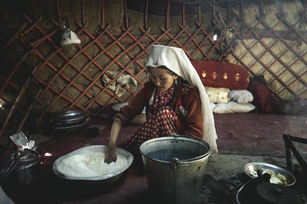 Woman kneading dough