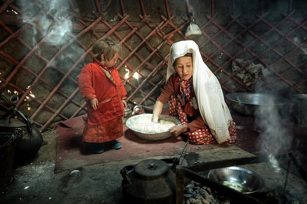 Woman and infant in traditional Kyrgyz traditional traditional traditional traditional traditional traditional traditional traditional traditional costume