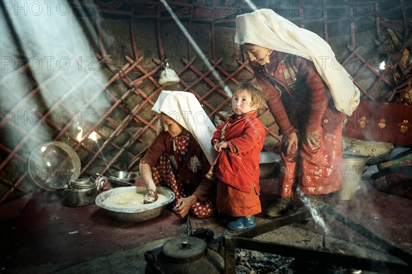 Two woman and a child in traditional Kyrgyz traditional traditional traditional traditional traditional traditional traditional traditional traditional costume