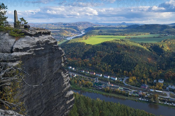View from the autumnal Lilienstein on the Elbe river near Koenigstein to Bad Schandau and over the German-Czech border with Mount Ruzova