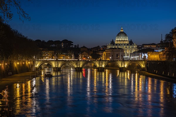 View over the Tiber at evening light on Ponte Sant`Angelo and St. Peter's Basilica