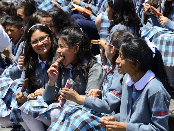 School class eating ice cream on the steps of the cathedral