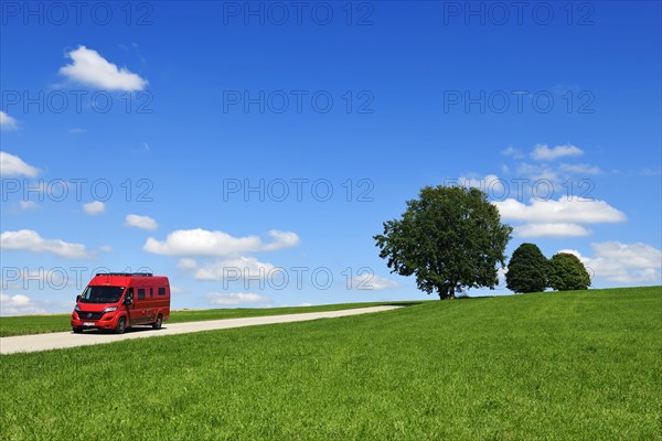 Motorhome on picture book country road near Berg