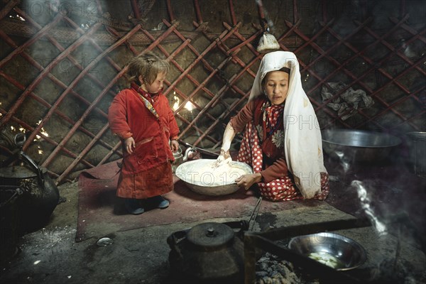 Woman and infant in traditional Kyrgyz traditional traditional traditional traditional traditional traditional traditional traditional traditional costume