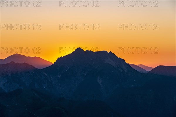 Sunset behind mountain silhouette