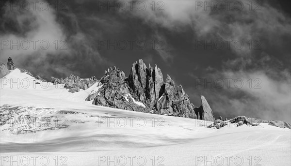 Rocky peaks rising out of the snow cover