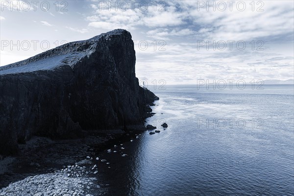 Rocky reef at the North Sea against the light