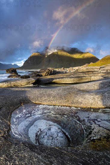 Rainbow over Bergen at the beach of Uttakleiv