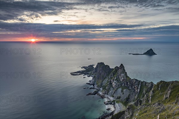 View from Matinden mountain to rocky coast at sunset