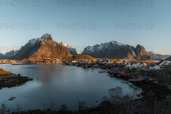 Reine with bringing in fjord at sunrise