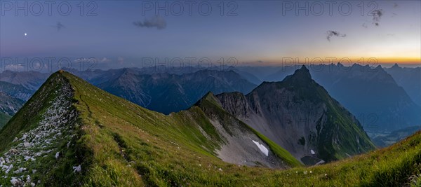 Summit ridge of Kreuzspitze with tent at the summit