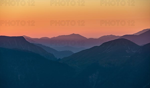 Sunset behind mountain silhouette