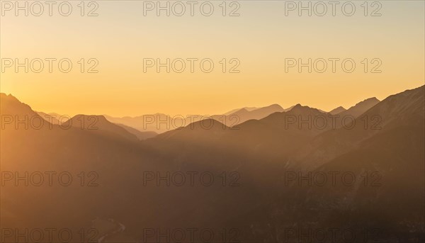 Sunset behind mountain silhouette