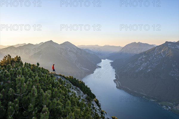 Young man looking over mountain landscape