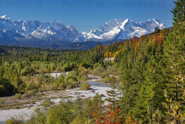 Autumn landscape in the Isar valley with Alpspitze and Zugspitze in the Wetterstein range