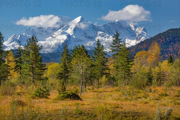 Autumn landscape in the Isar valley with Alpspitze and Zugspitze in the Wetterstein range