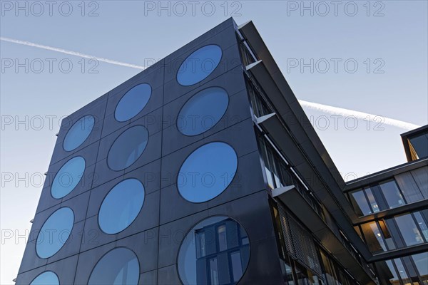 Facade with blue portholes