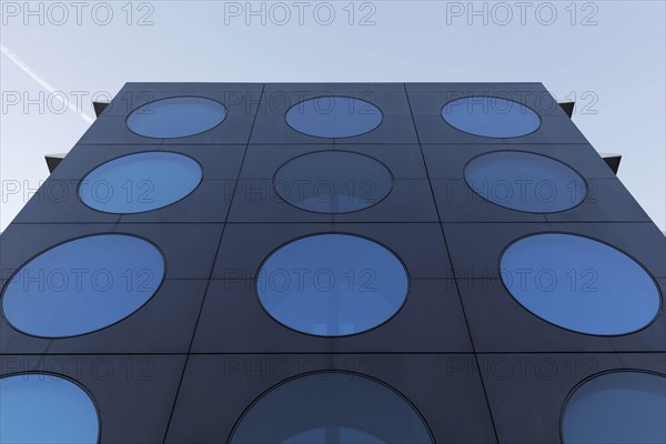 Facade with blue portholes