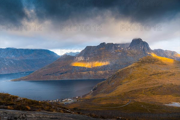 View of the village of Fjordbotn and a prominent and pointed mountain