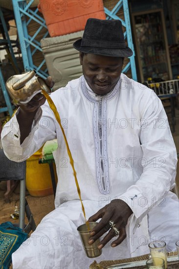 Local man pouring tea