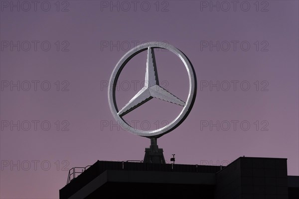 Illuminated Mercedes star on Mercedes Benz building in Stuttgart-Untertuerkheim