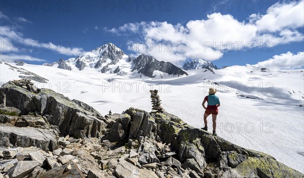 Hiker standing in front of glacier