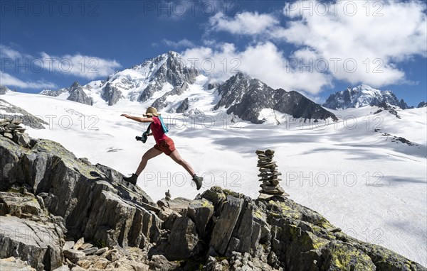 Hiker sprinting over rocks