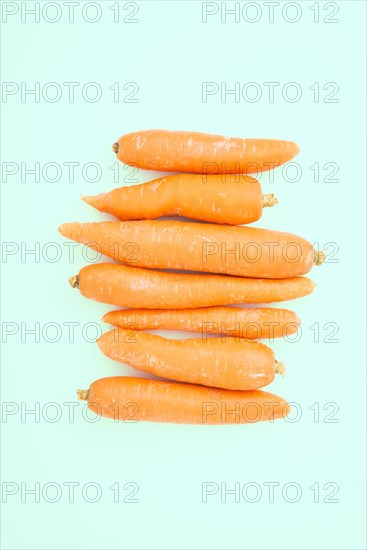 Raw yellow beets on turquoise background