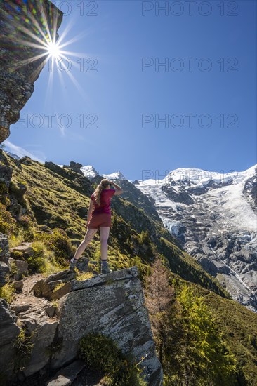 Hiker looking at glacier Glacier de Taconnaz