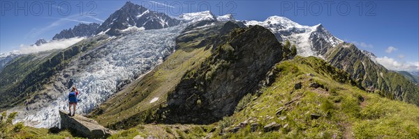 Hiker in front of glacier tongue