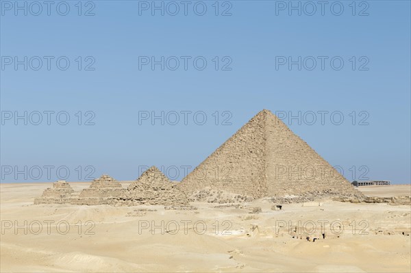 The pyramid of Menkaure next to the queen's pyramids